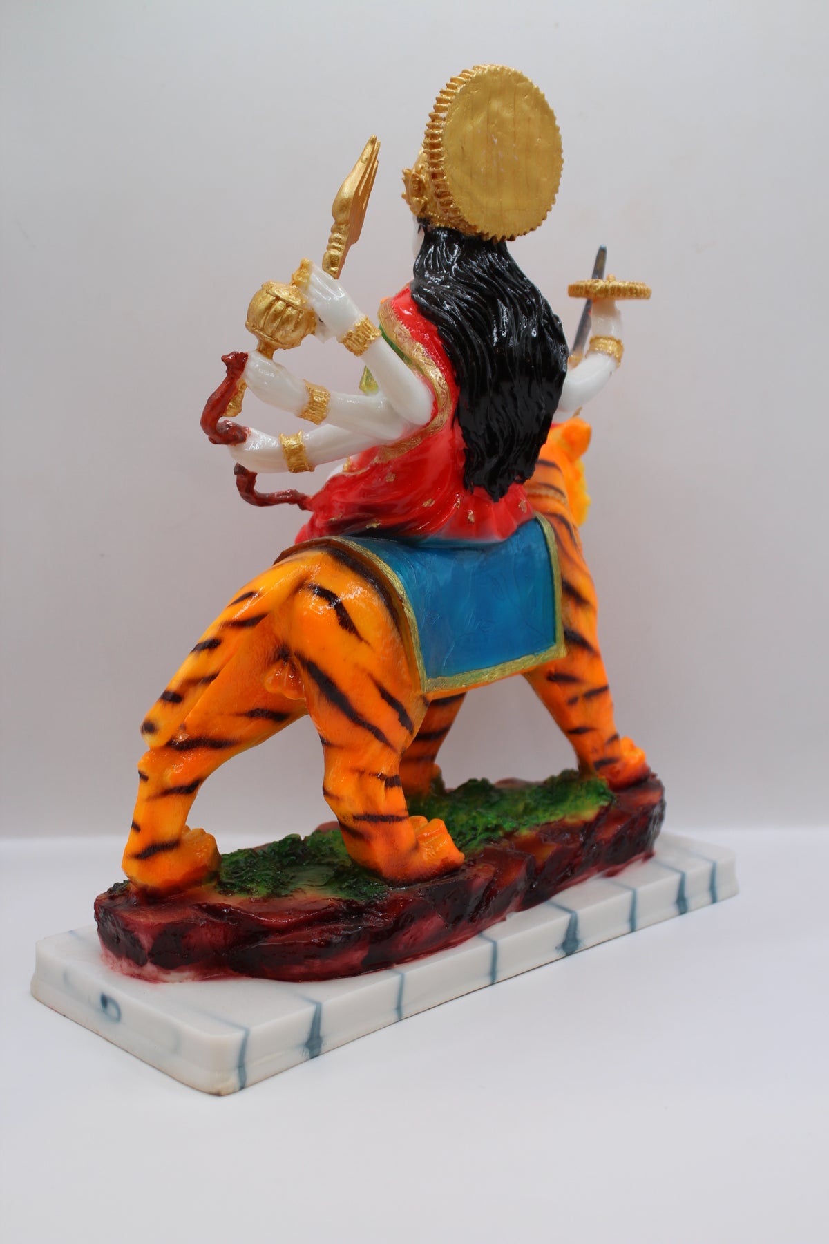 Resin Ambe Maa statue, red dress on tiger, white base, back view