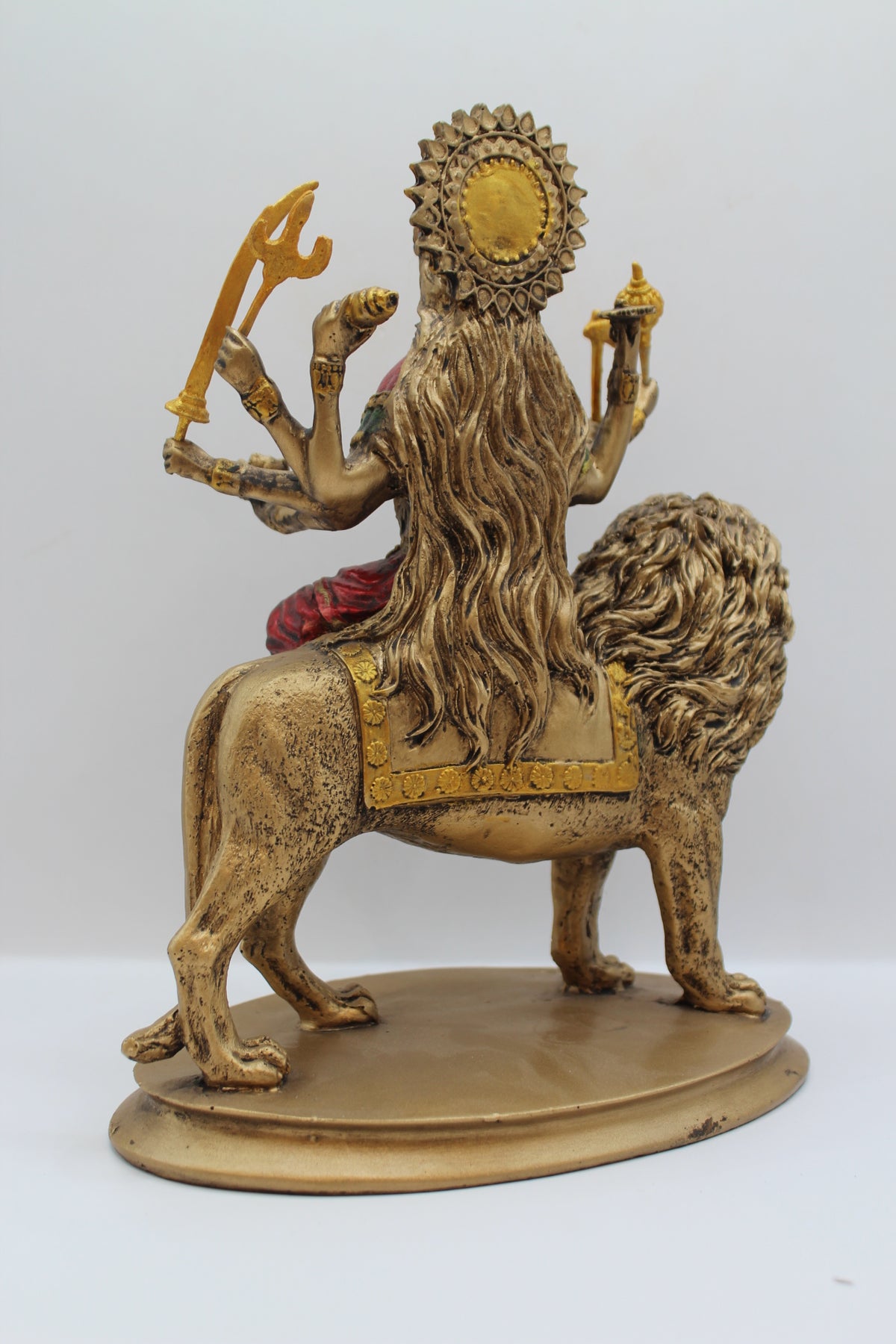 Resin Ambe Maa statue, seated on lion, antique bronze, back view
