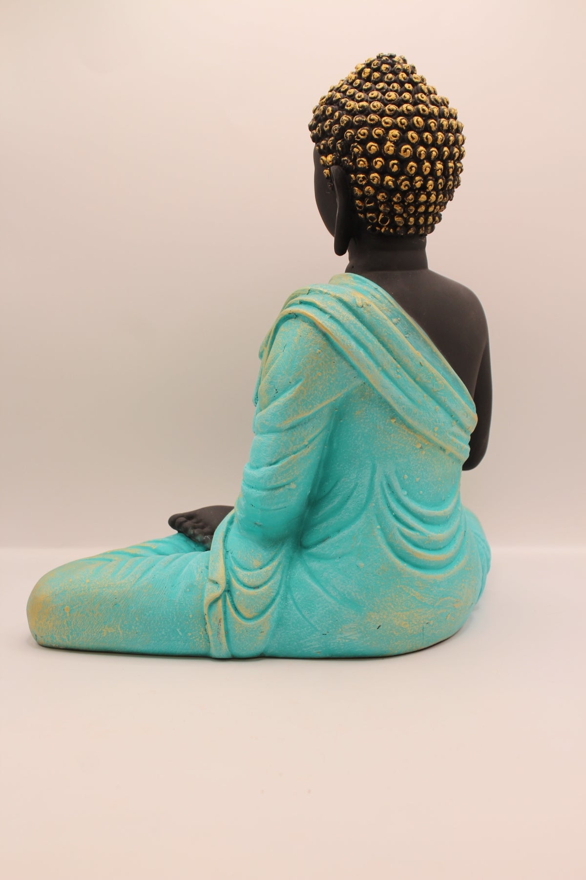 Sea blue and black Buddha statue, back
