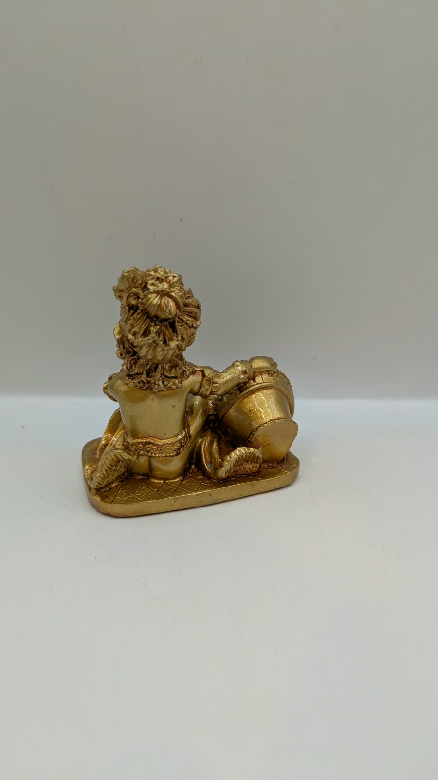 Gold Makhan Chor baby Krishna statue, back view