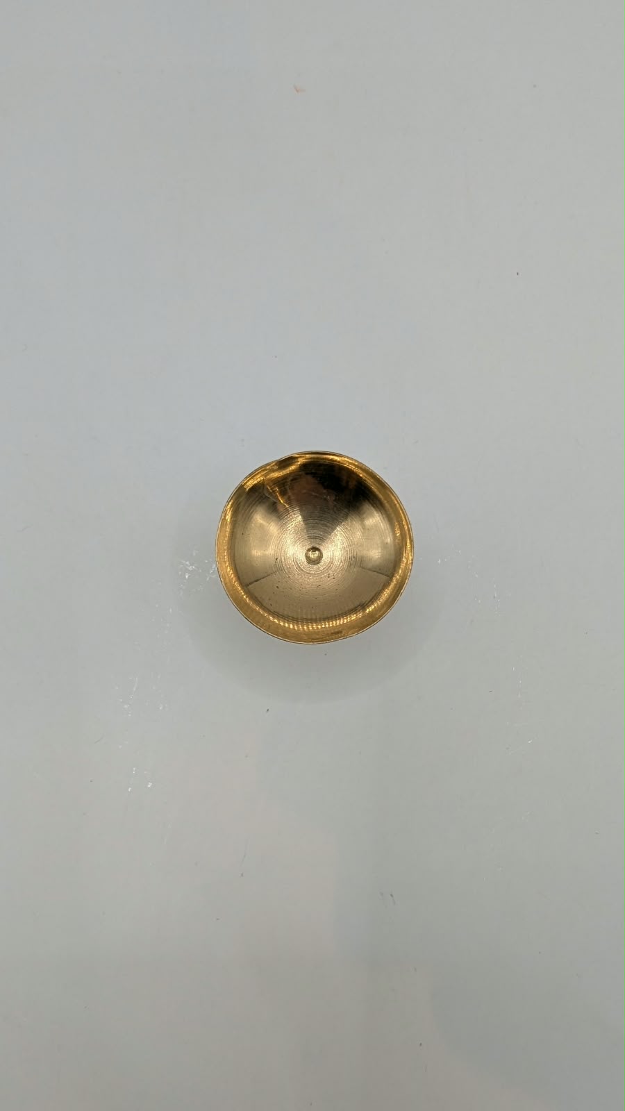Mini metal diya on stand, top view