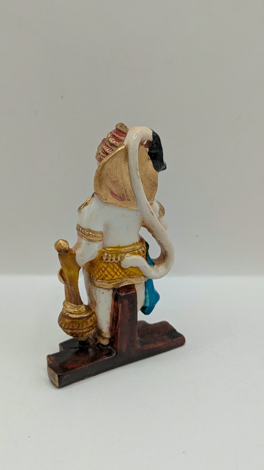 Blue and yellow standing Hanuman resin statue, back view