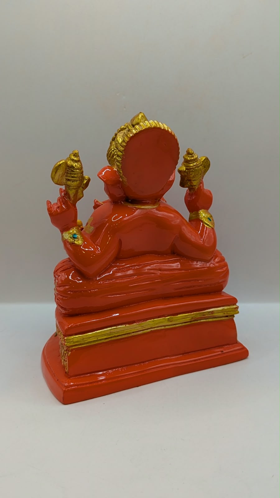 Orange Ganesh statue, back view