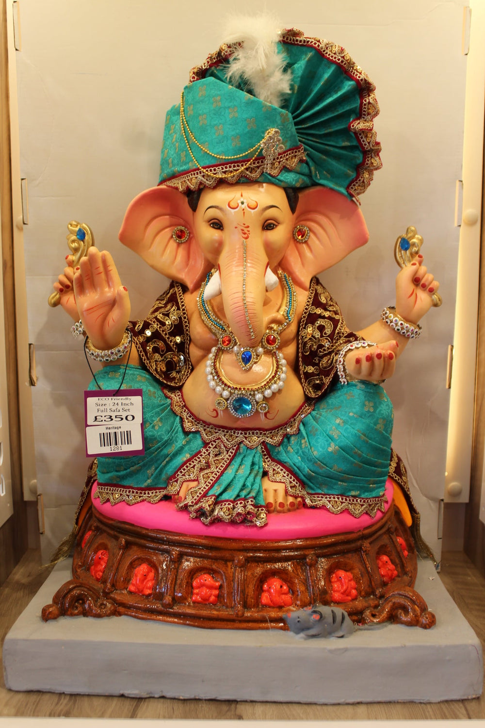 Eco-friendly Ganesh idol in a full safa set with teal velvet and gold