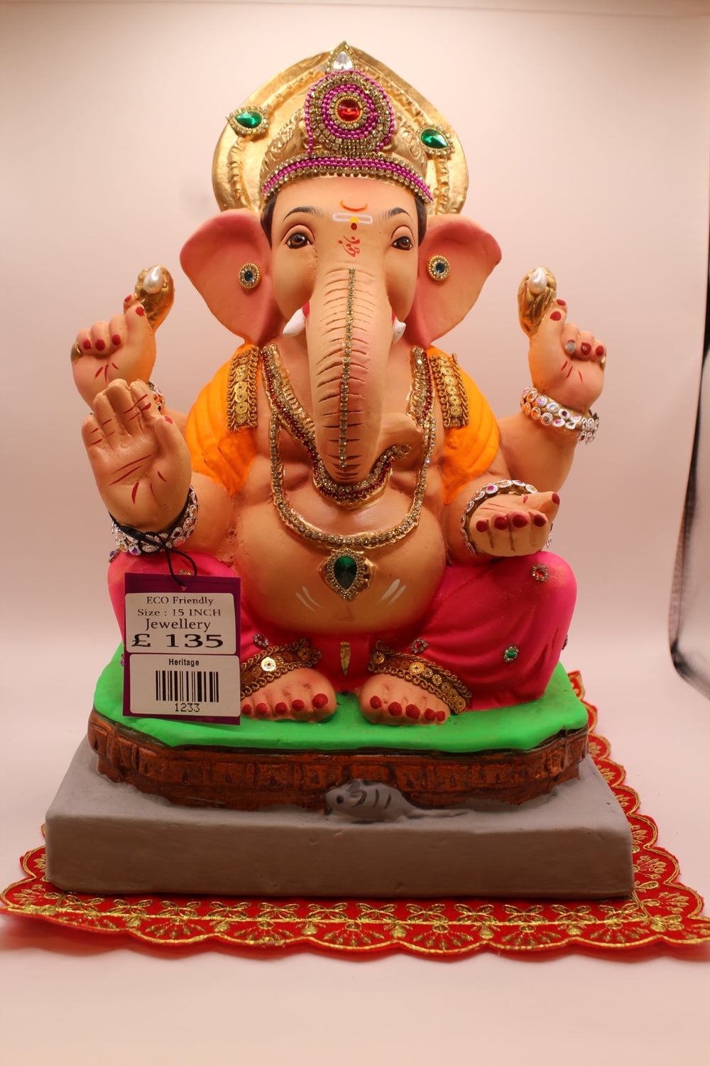 Eco-friendly Ganesh idol in jewellery style with an emerald mukut