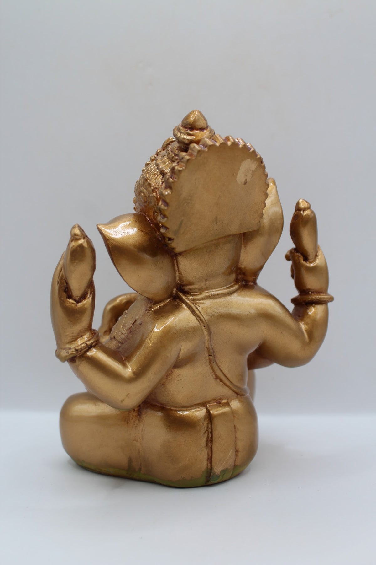 Copper gold resin Ganesh murti seated, back view
