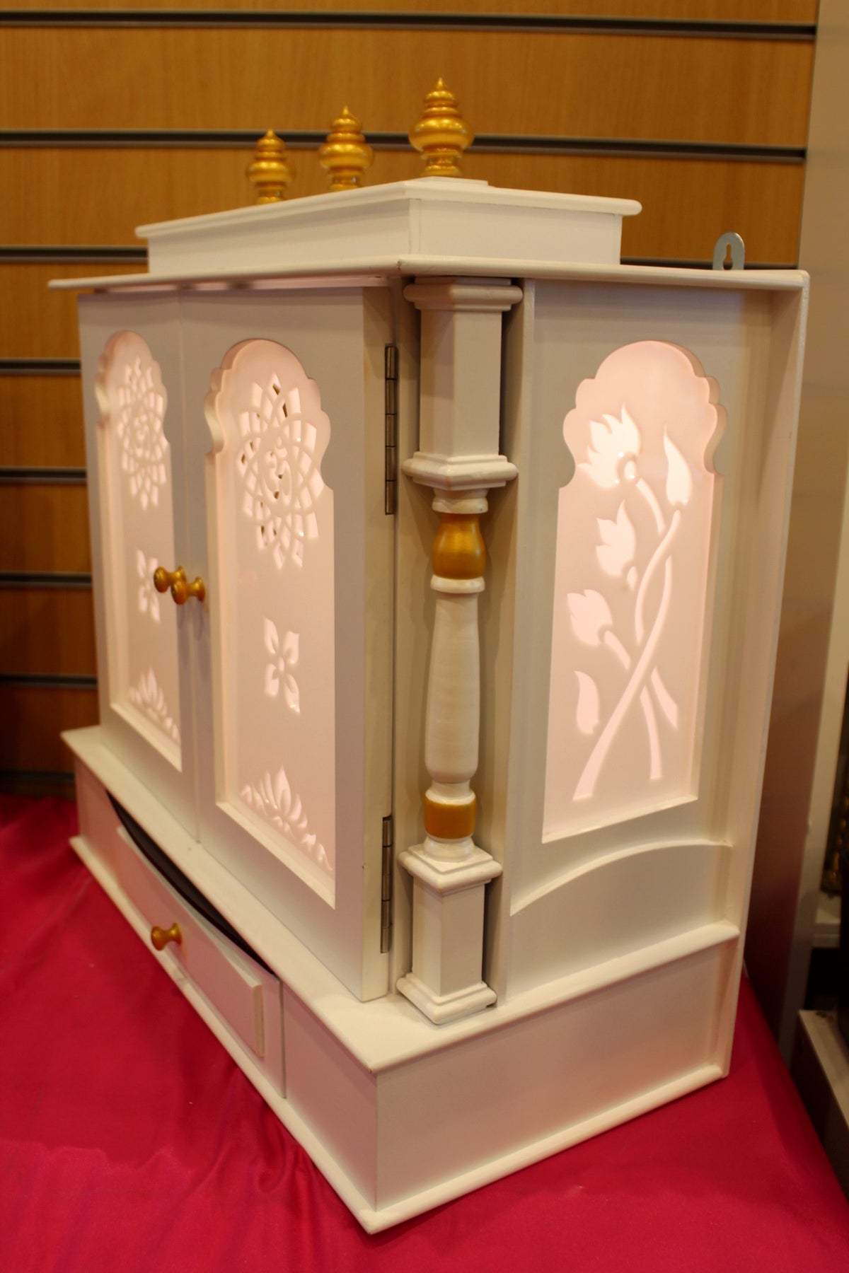Side profile of the ivory puja mandir