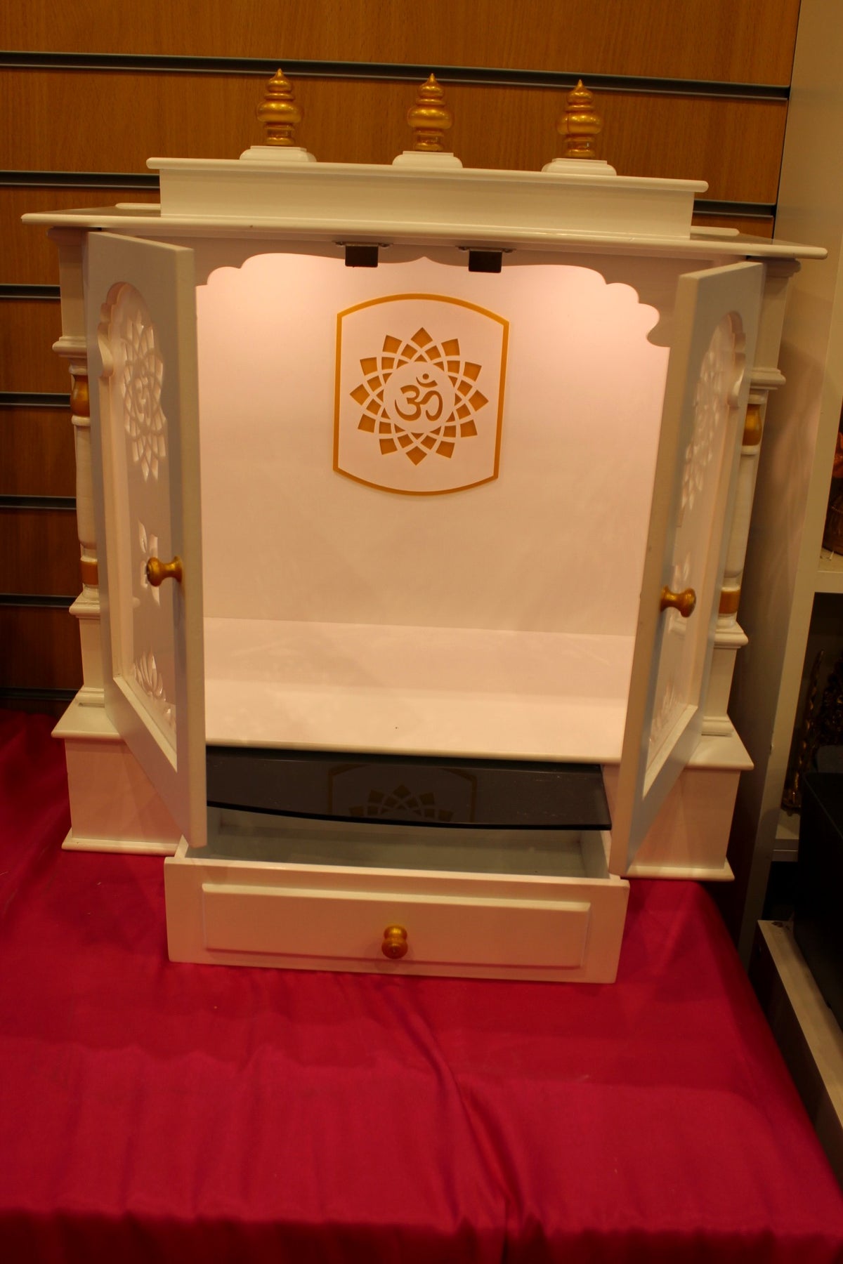 Interior of the cream mandir with Om back panel