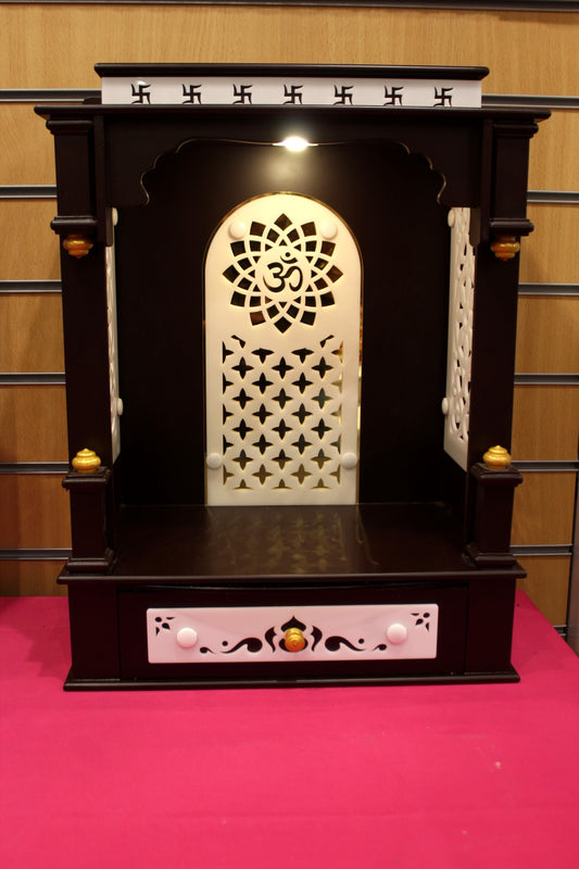 Dark wood open-front mandir with Om jali arch and lights, front view