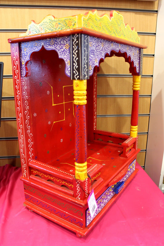 Large hand-painted red Jaipuri mandir with yellow canopy, front view