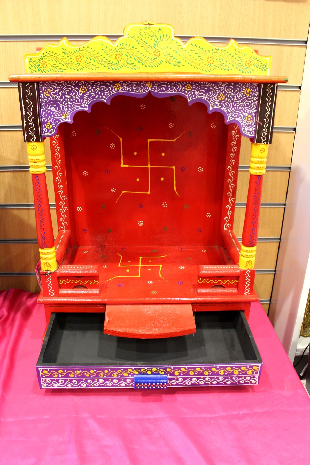 Close-up of the gold swastik on the red painted back panel