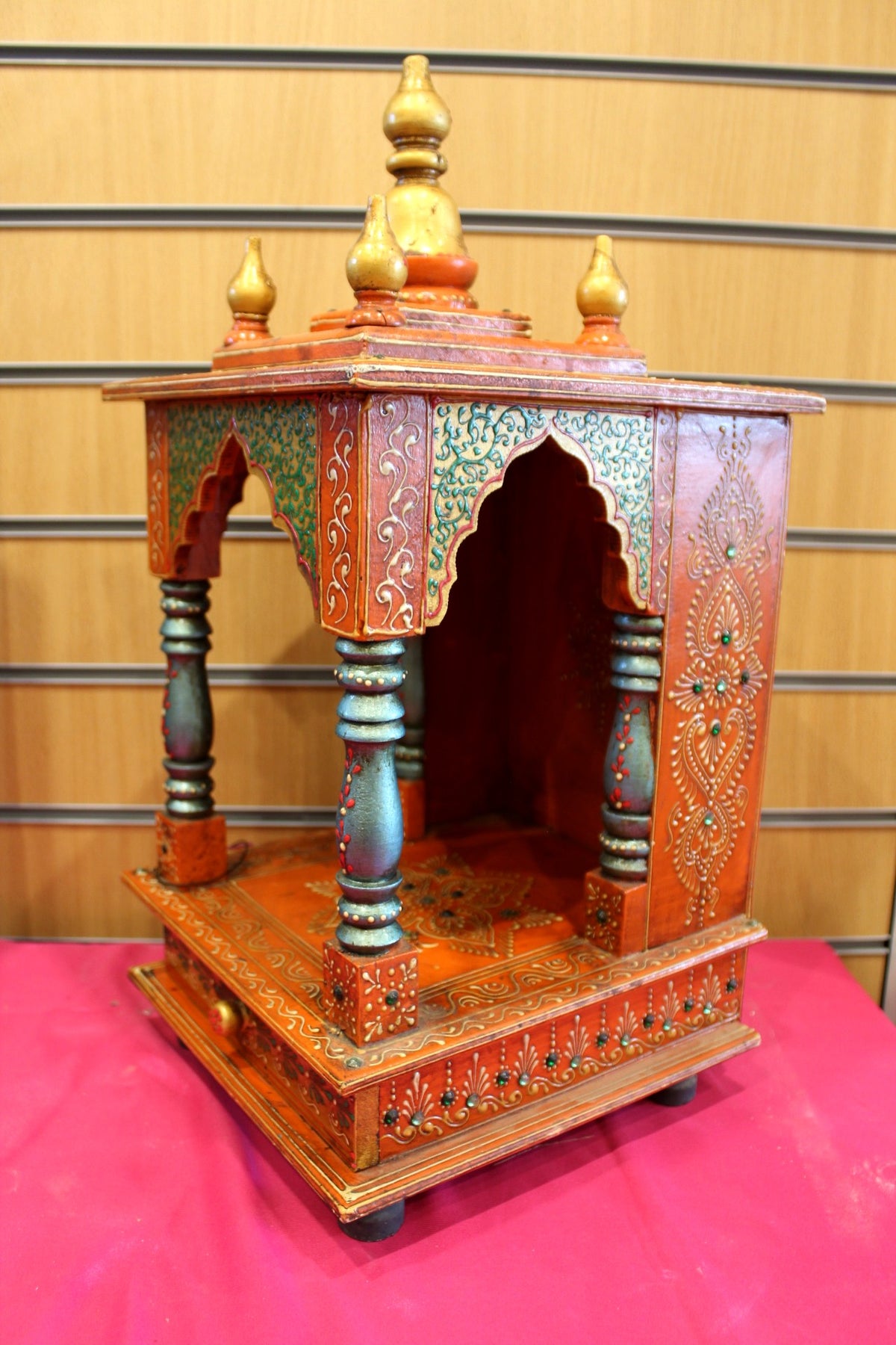 Close-up of gold kalash finials along the mandir roof