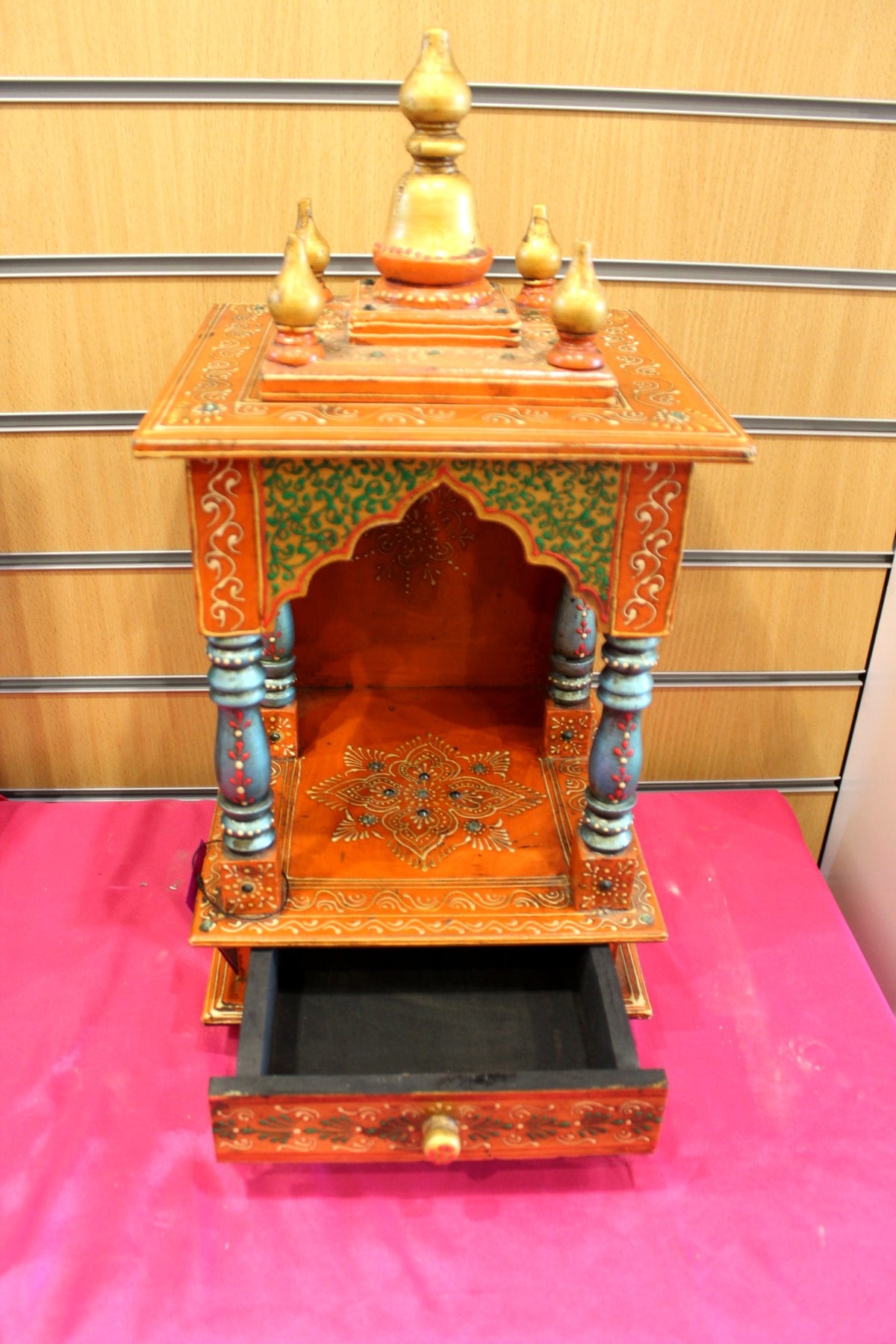 Orange Jaipuri mandir with base drawer open for puja essentials