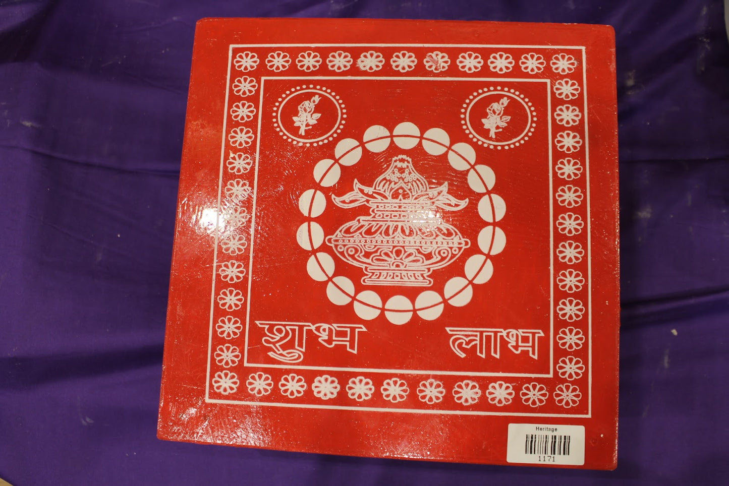 Top view of red bajot chowki with kalash and floral border