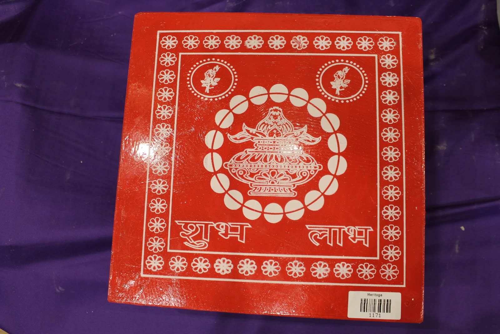Top view of red bajot chowki with kalash and floral border