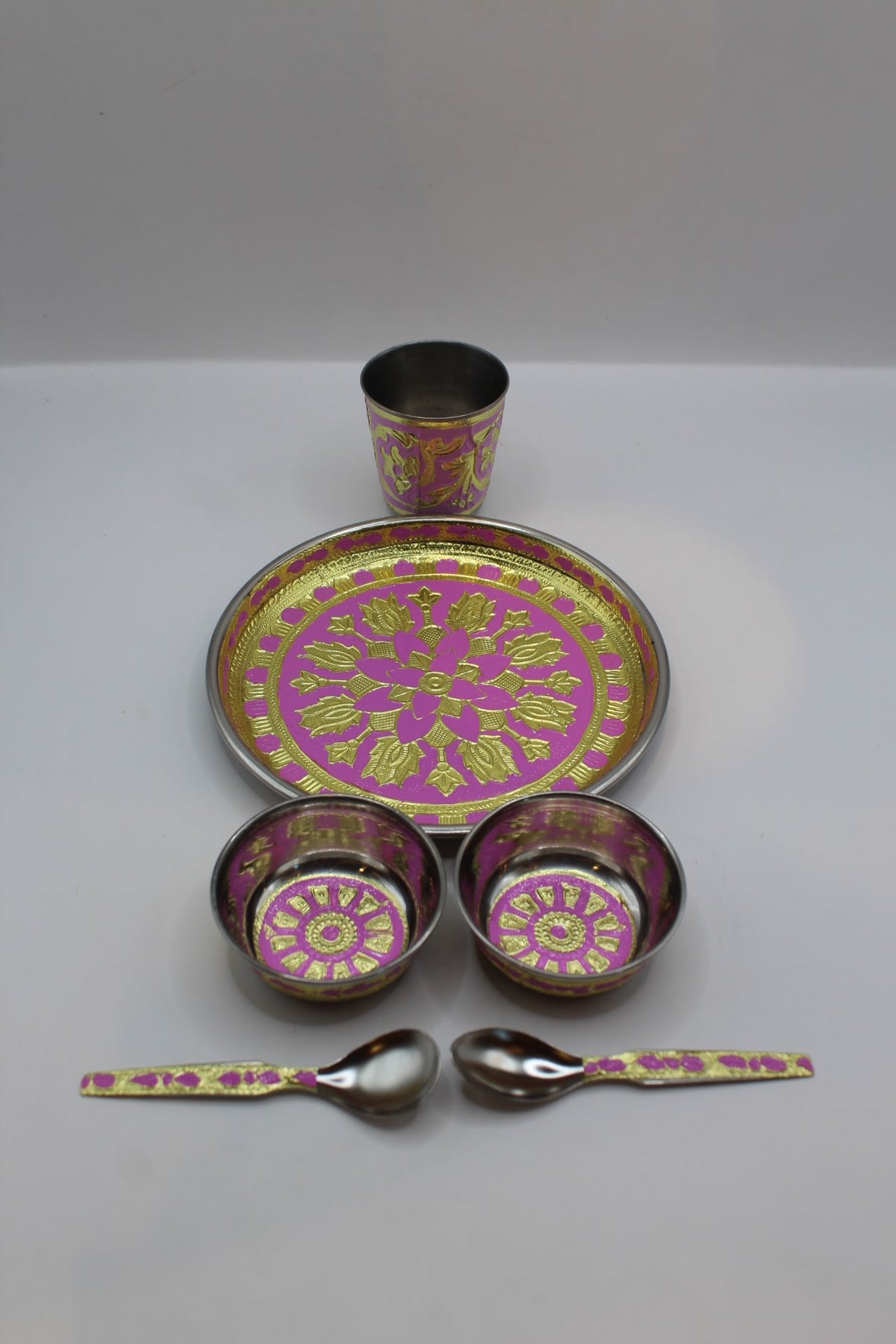 Pink pooja set No. 1 with thali, bowls, glass and spoons, side view