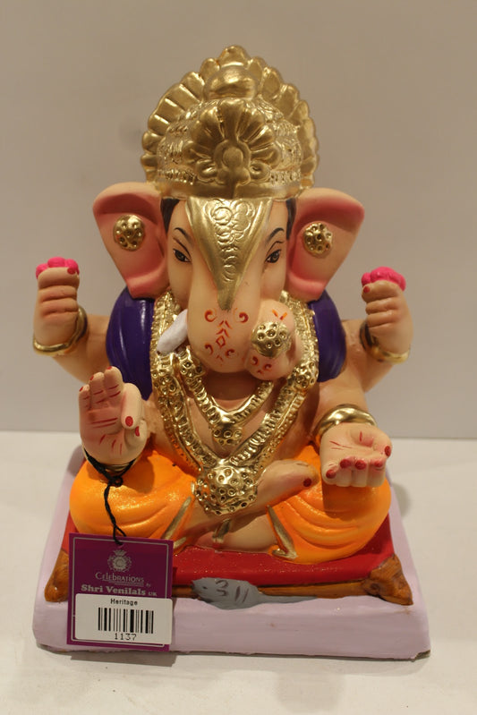 Eco-friendly clay Ganesh idol with purple shawl and orange dhoti, front view