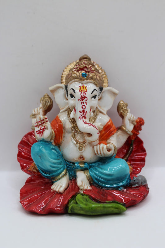 Resin Ganesh murti on red leaf, blue dhoti, front view