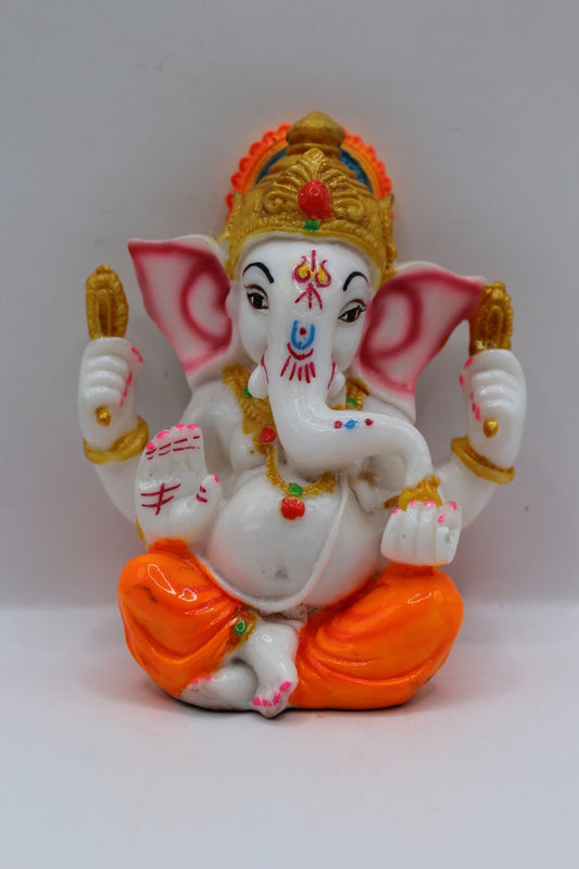 Small white resin Ganesh murti, orange dhoti, front view