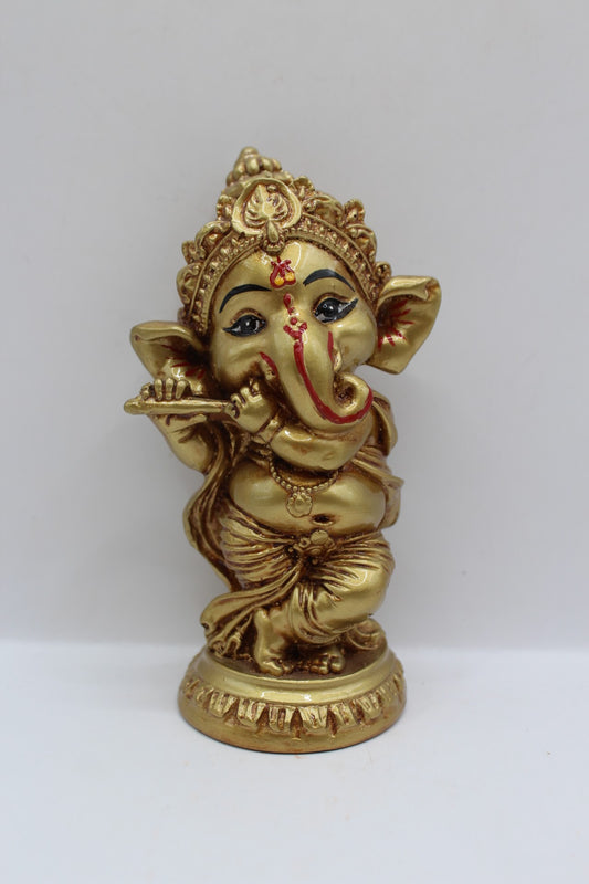 Gold resin Ganesh murti standing, playing flute, front view