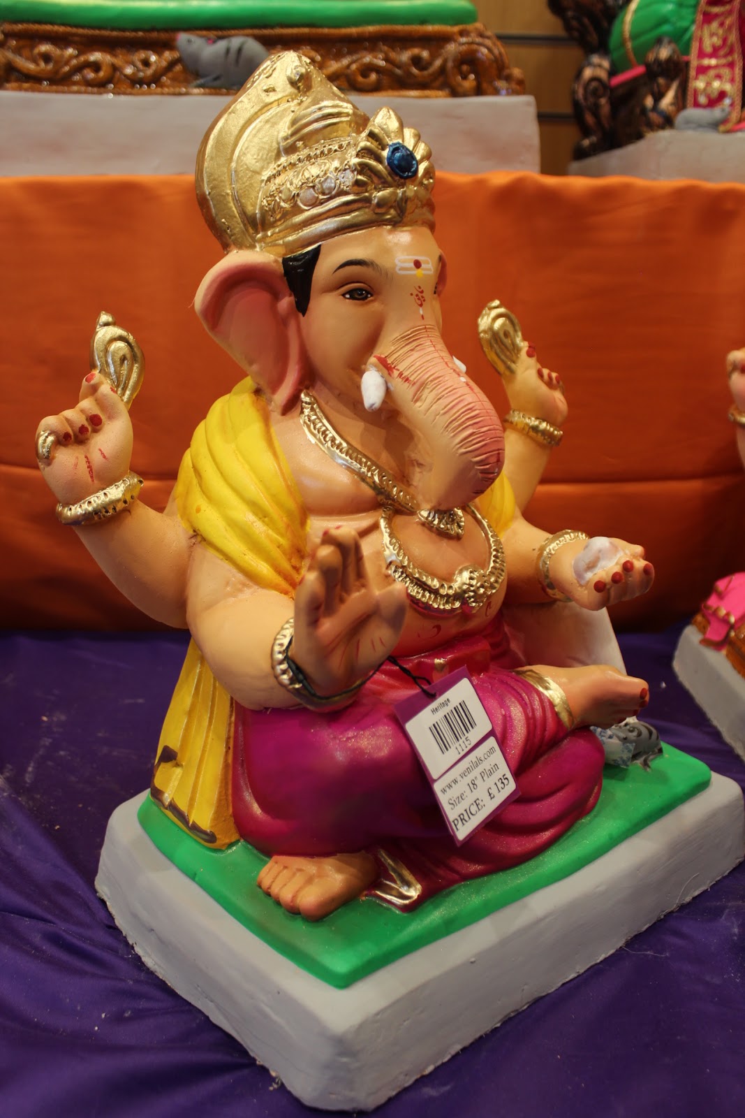 Eco-Friendly Ganesh Visarjan idol, Magenta & Gold, close-up