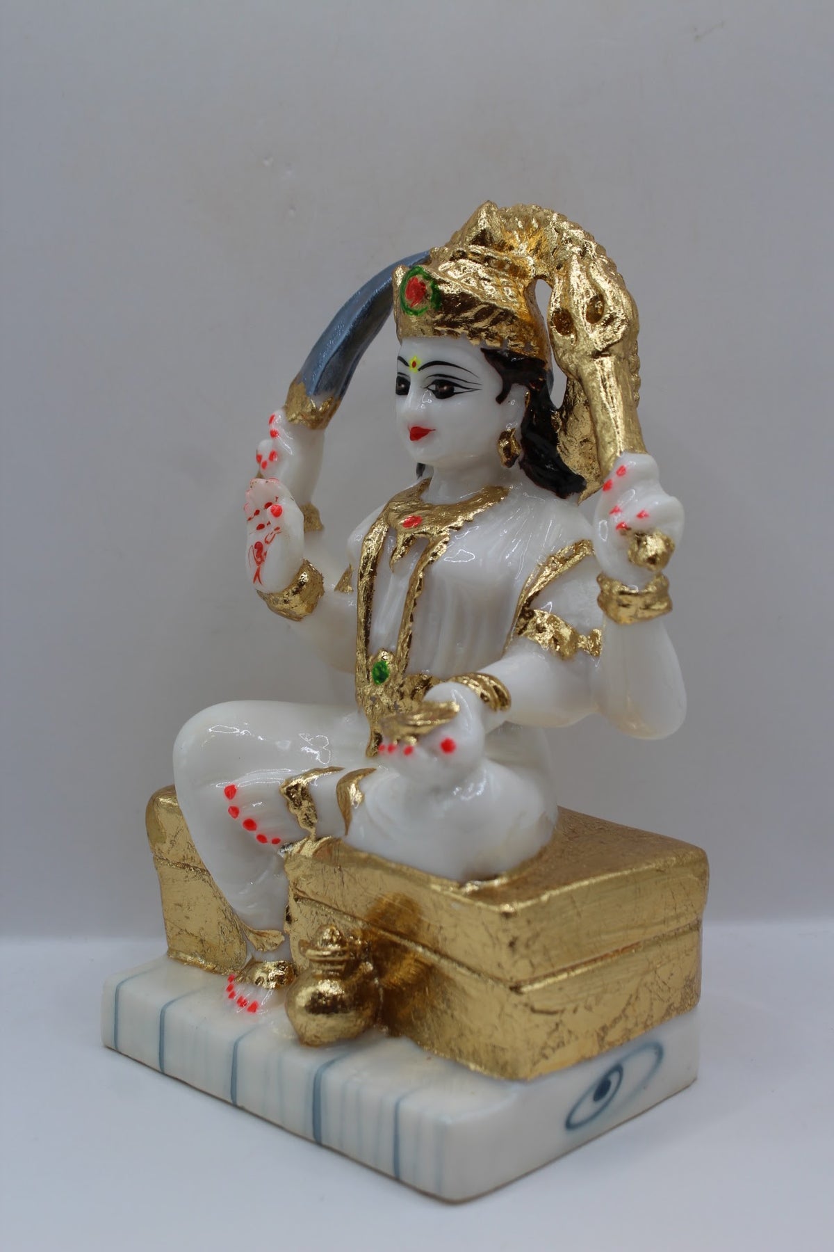 White and gold resin Santoshi Maa murti, right side view