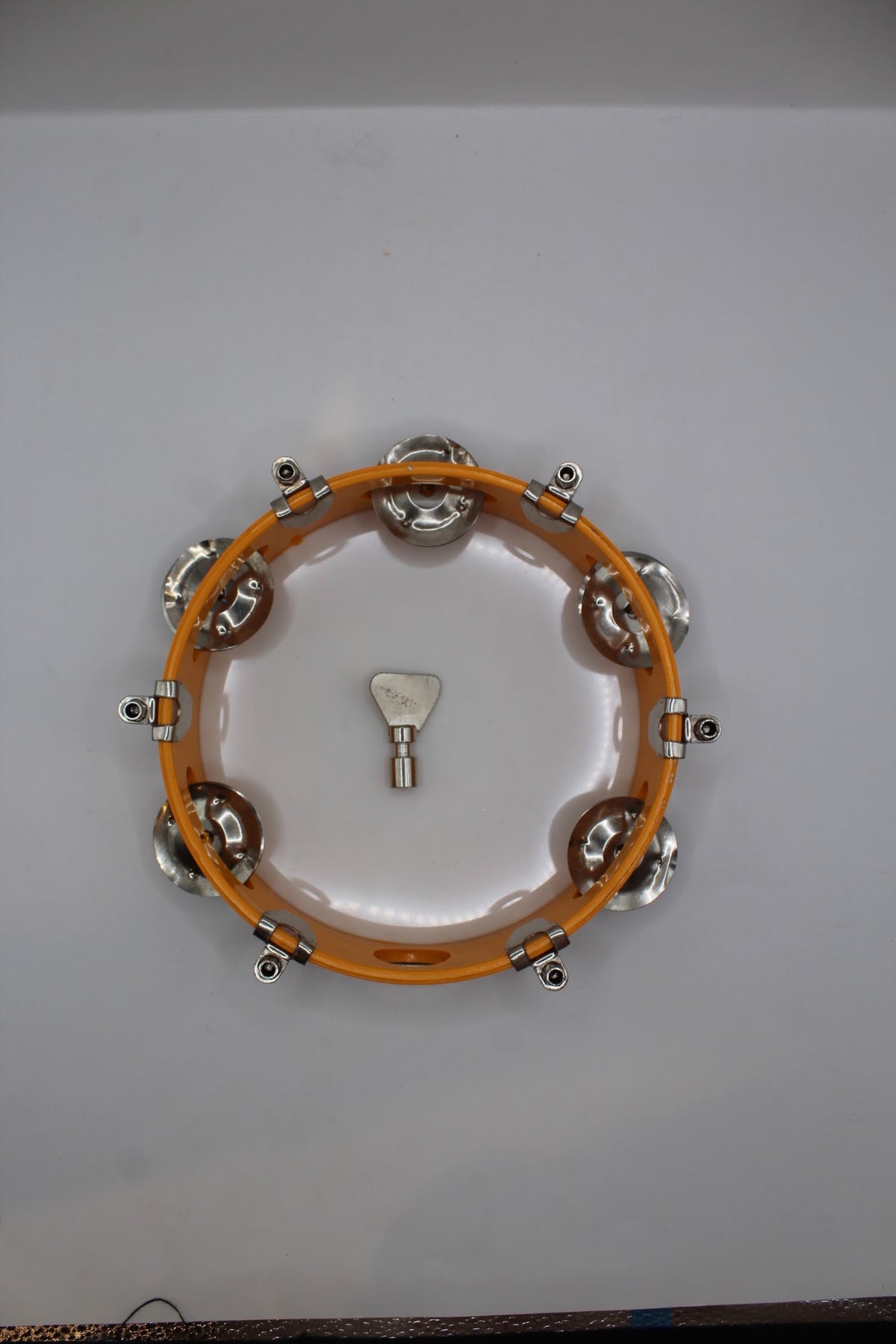 Orange khanjari tambourine 7 inch, side view