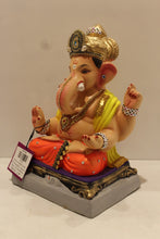 Load image into Gallery viewer, Eco-friendly clay Ganesh idol in jewellery style with yellow khes and orange dhoti, side view