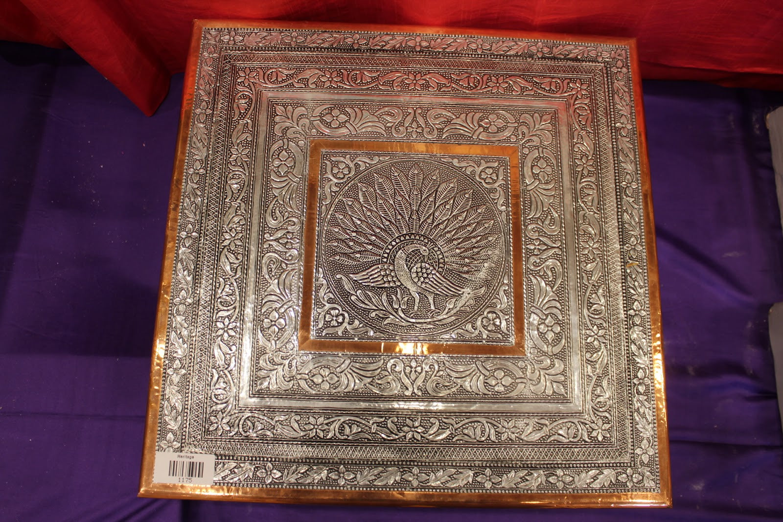 Oxidised silver bajot pooja chowki close-up of peacock embossing