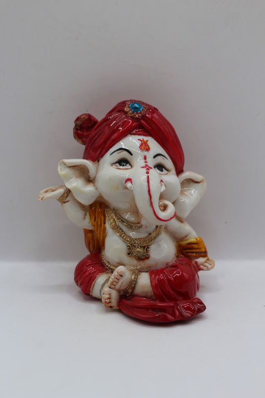 Baby Ganesh murti, red turban and red dhoti, front view