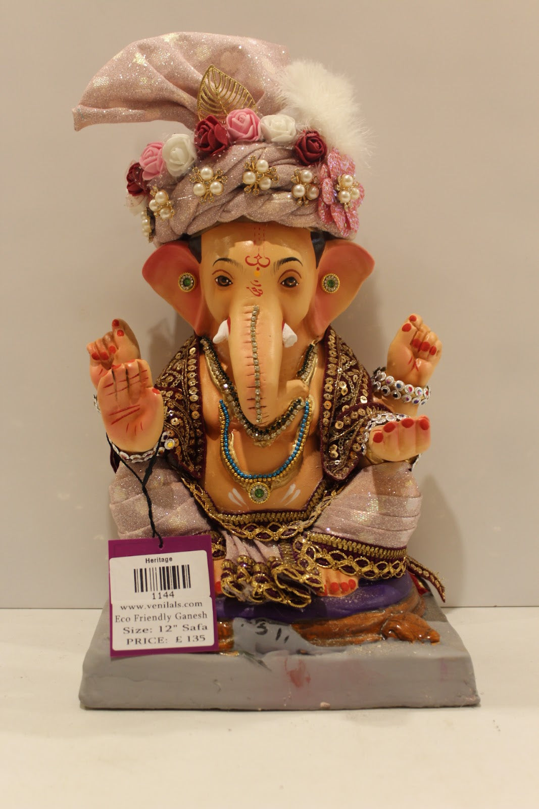 Eco-friendly clay Ganesh idol with blush pink rose safa, front view