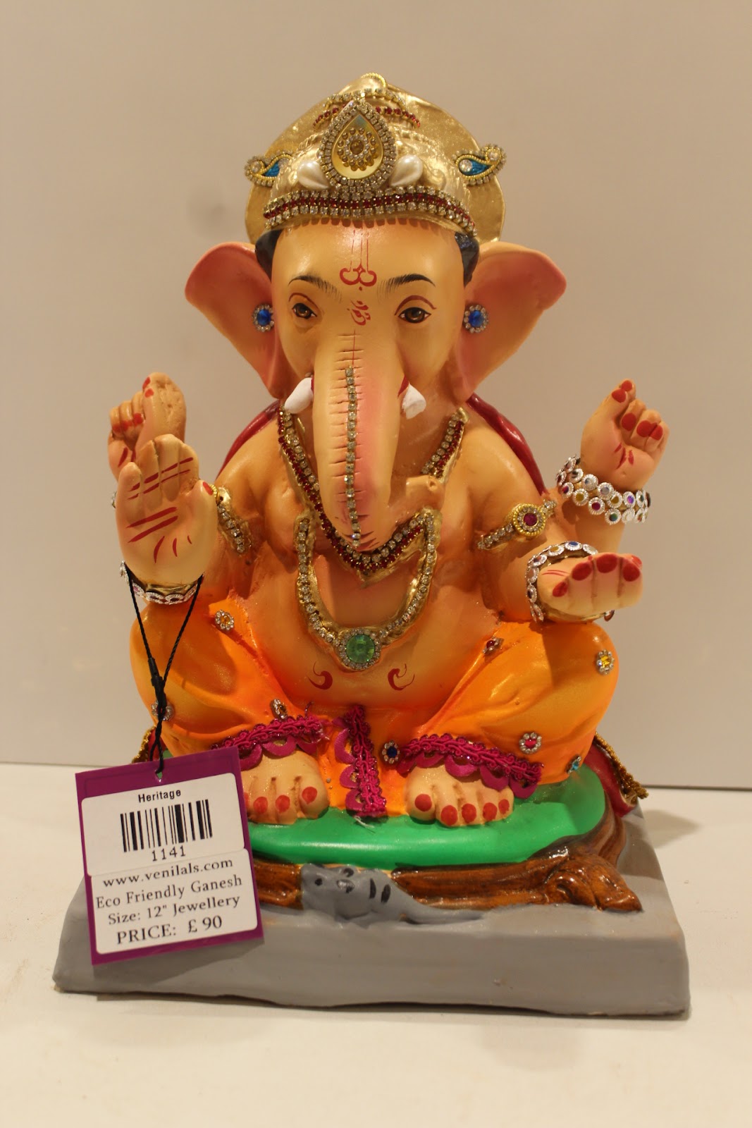 Eco-friendly clay Ganesh idol in jewellery style with blue gem crown, front view