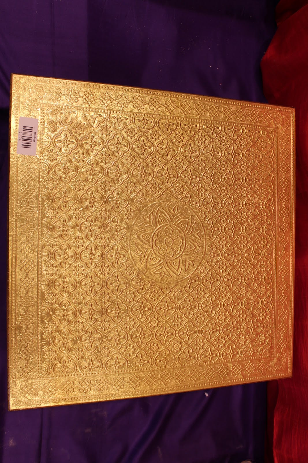 Gold embossed bajot pooja chowki close-up of embossed pattern