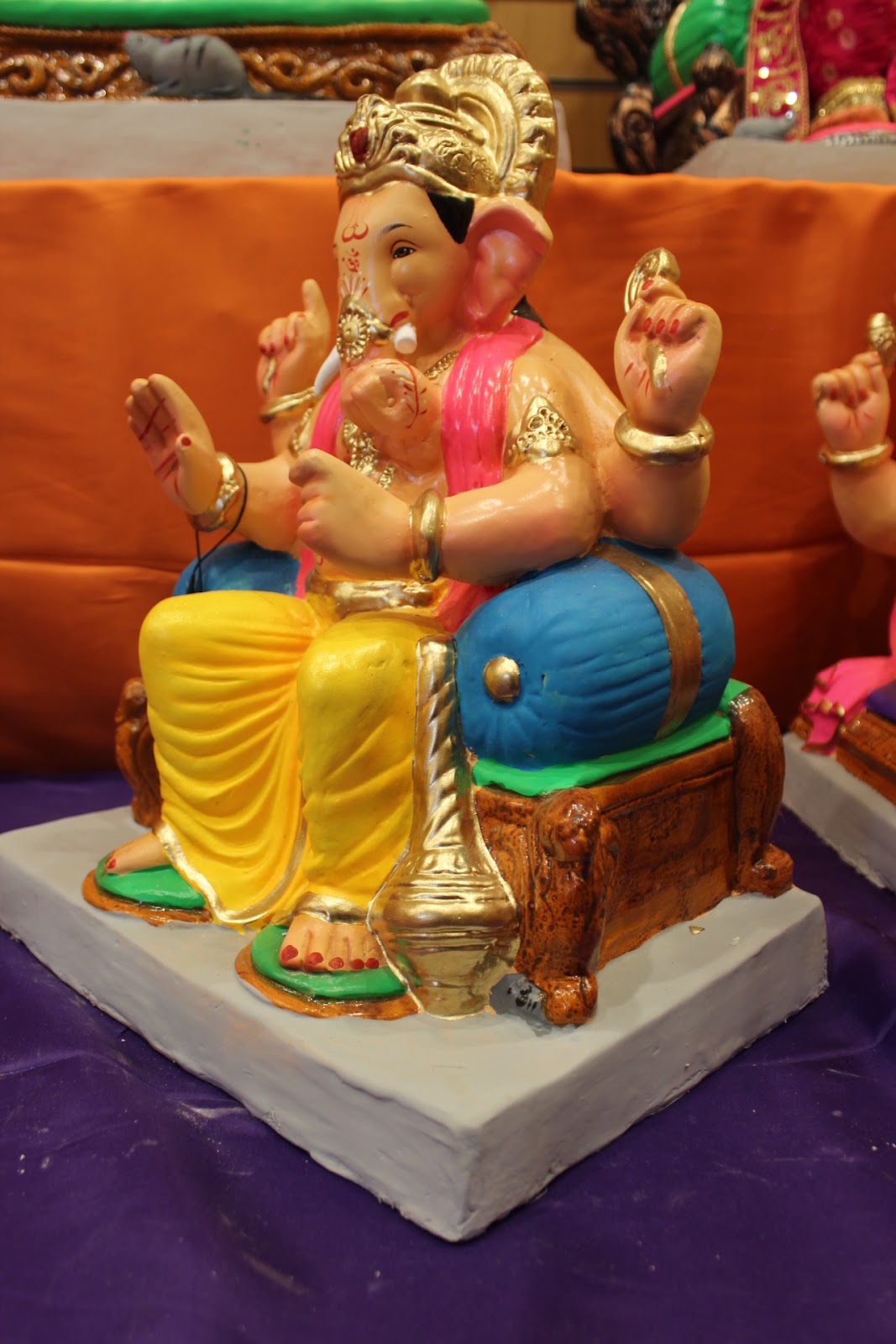 Eco-Friendly Ganesh Visarjan idol, Yellow & Pink Drum Base, side view