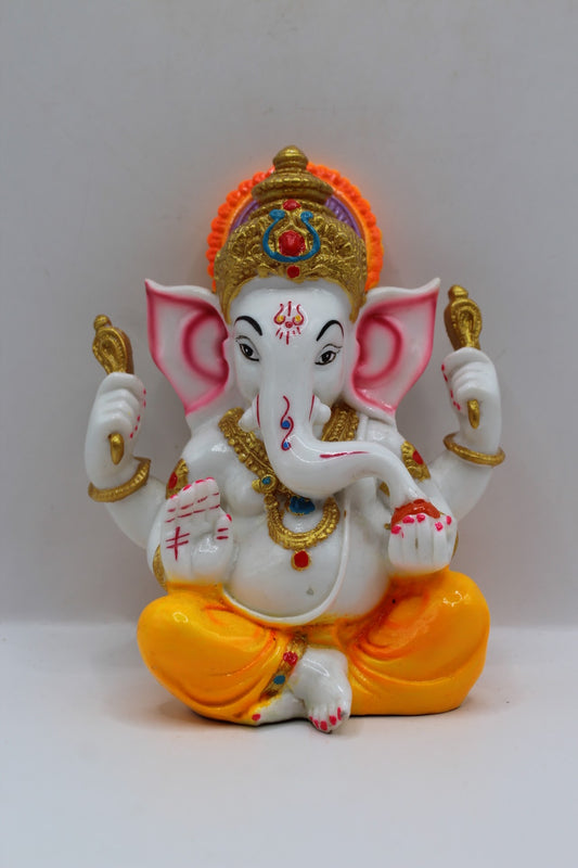 White resin Ganesh murti, yellow dhoti, front view
