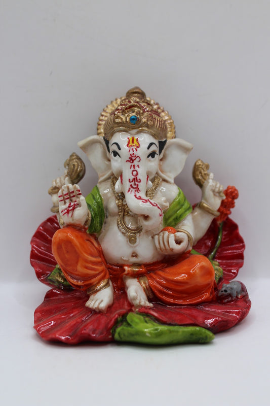 Resin Ganesh murti on red leaf, orange dhoti, front view