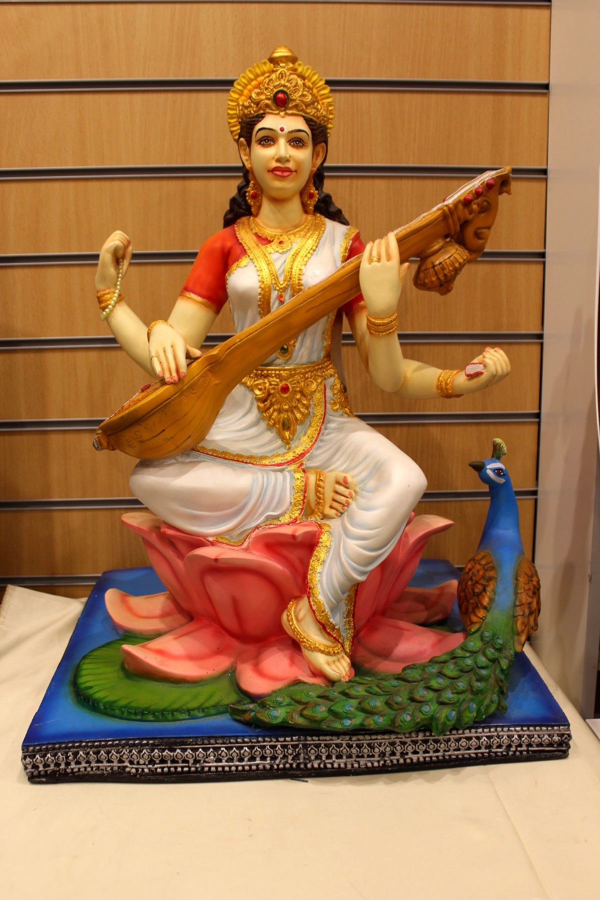 Resin/Fibre Saraswati Statue for Home Temple – Veena on Lotus with Peacock, 25 inch