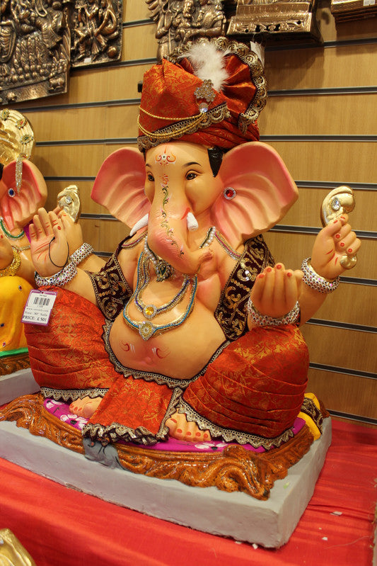 Eco-Friendly Ganesh Idol - Orange Safa & Pink Cushion, angle view
