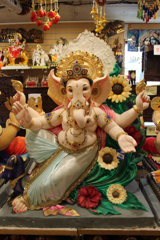 POP Ganesh Visarjan idol, dancing pose with floral peacock backdrop, front view