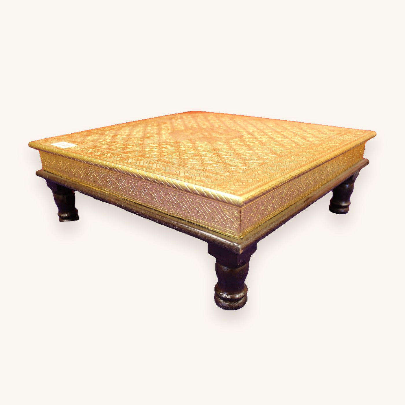 Gold embossed bajot with floral medallion, angled view