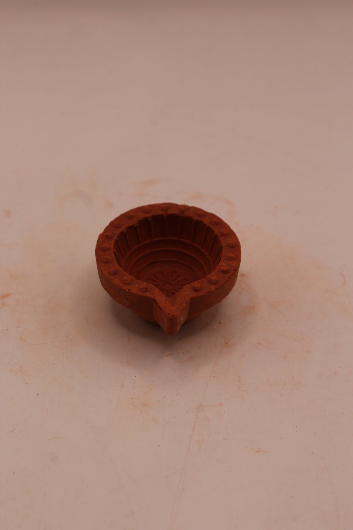 Extra Small clay diya, back