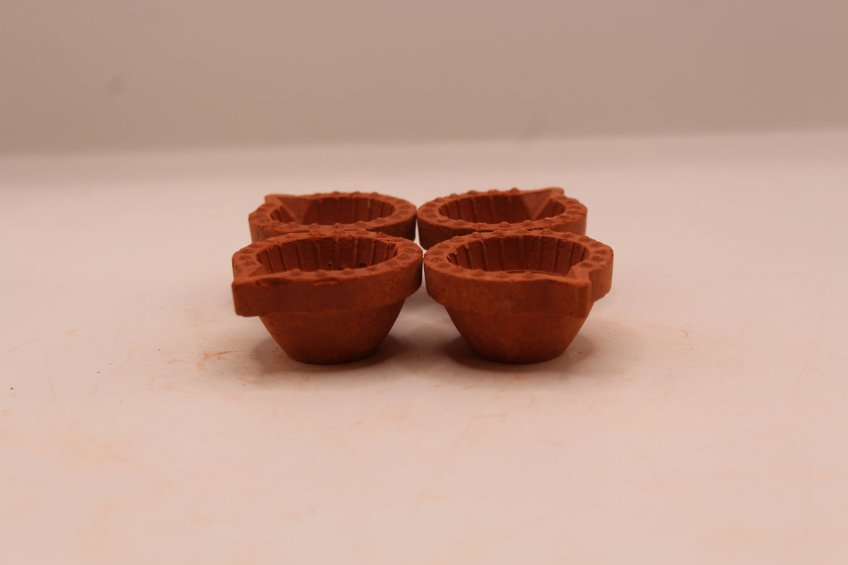 Extra Small clay diya, left