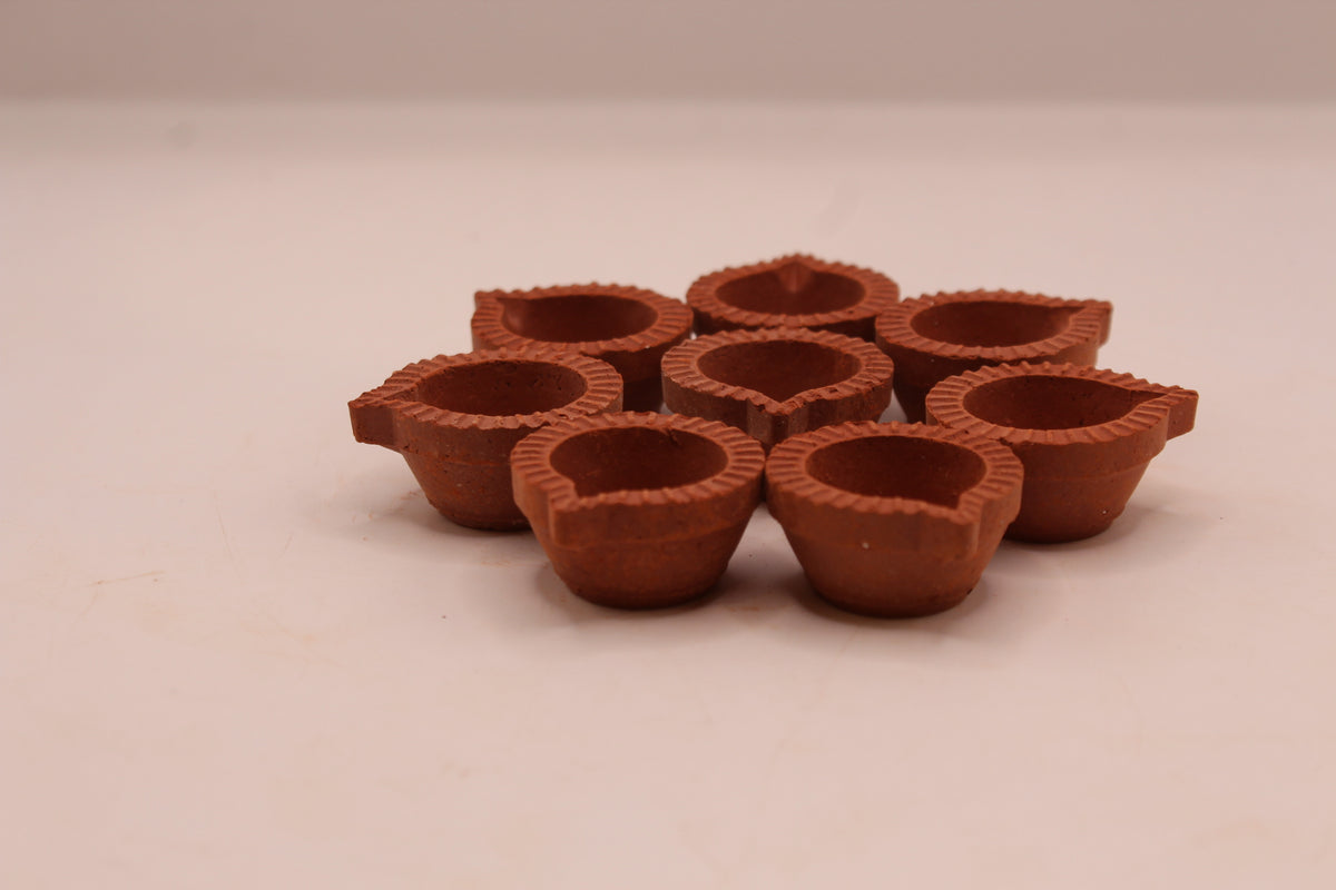 Extra Small clay diya, left