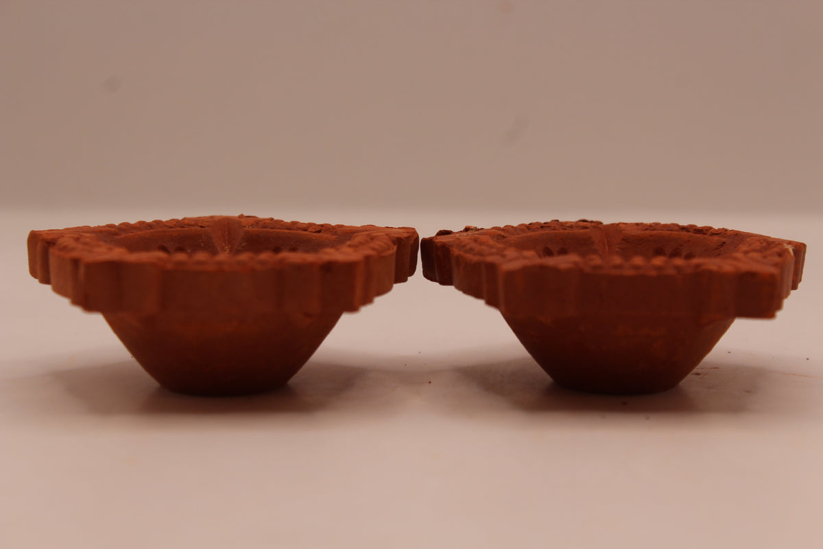 Five Face Star Shape clay diya, left