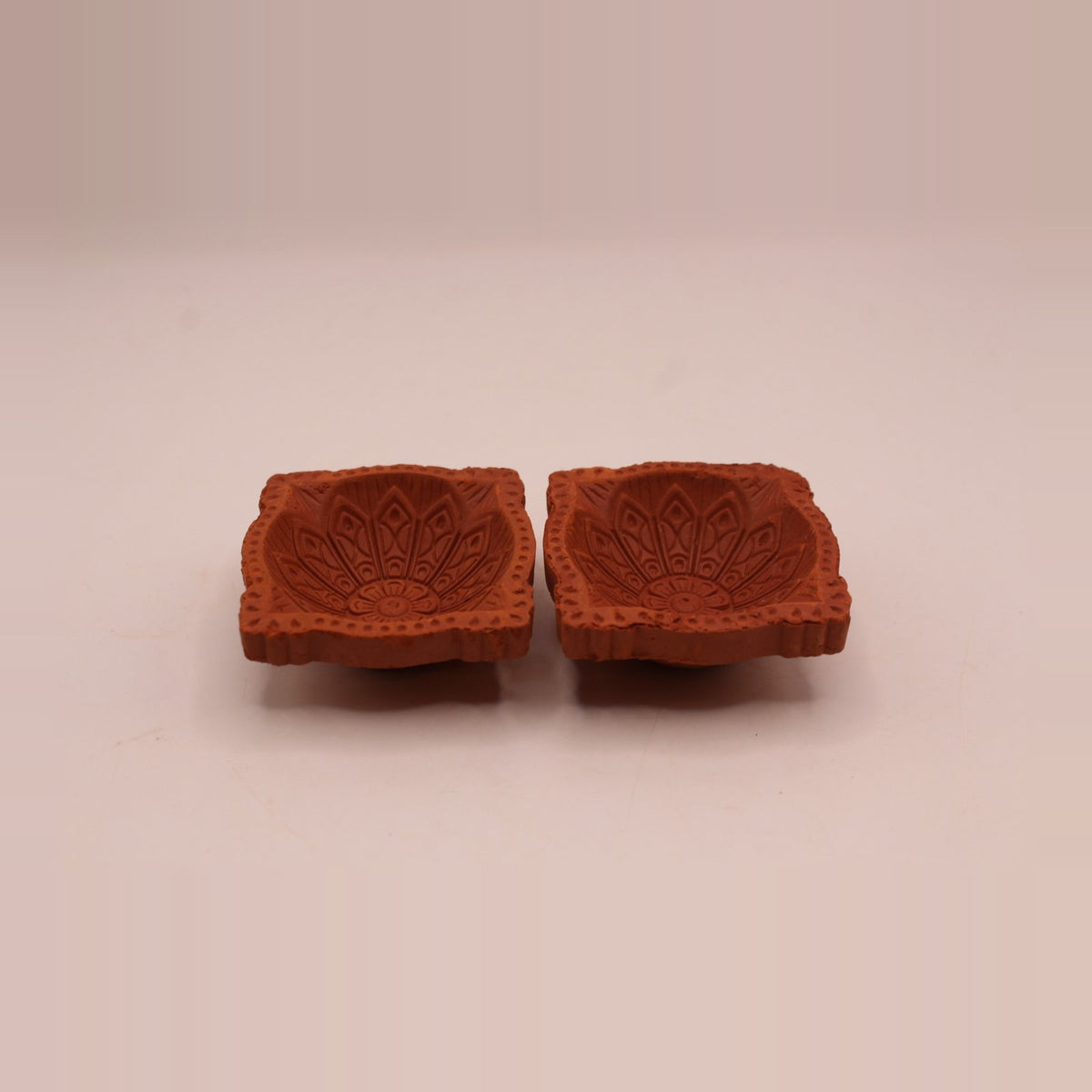 Four face clay diya, pack of 2