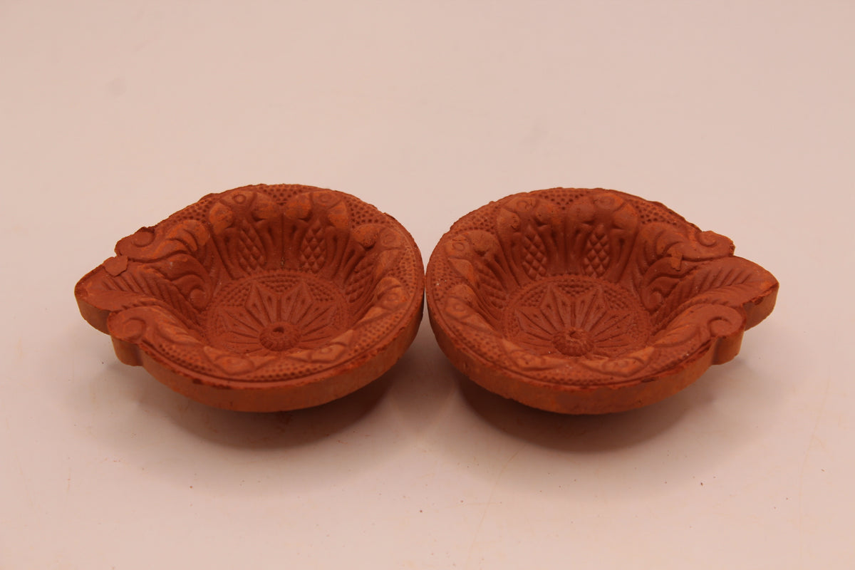 One Face Floral clay diya, left