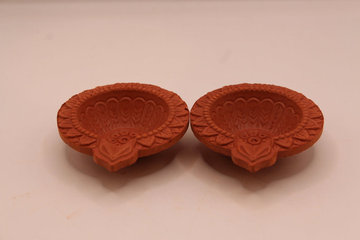 One Face Floral clay diya, front