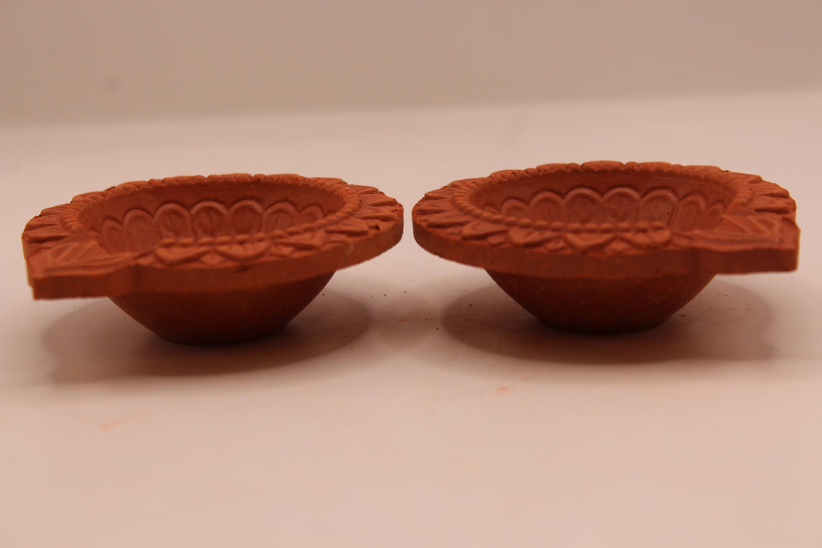 One Face Floral clay diya, left