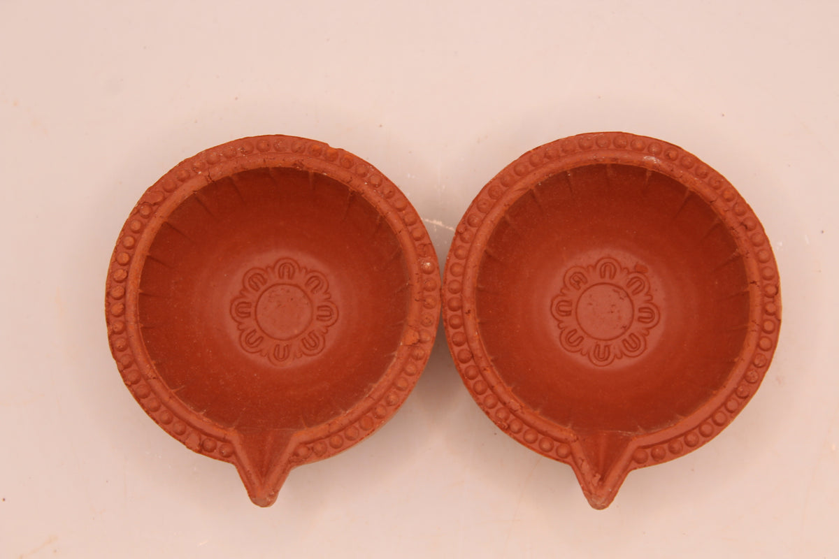 One Face Lined clay diya, above