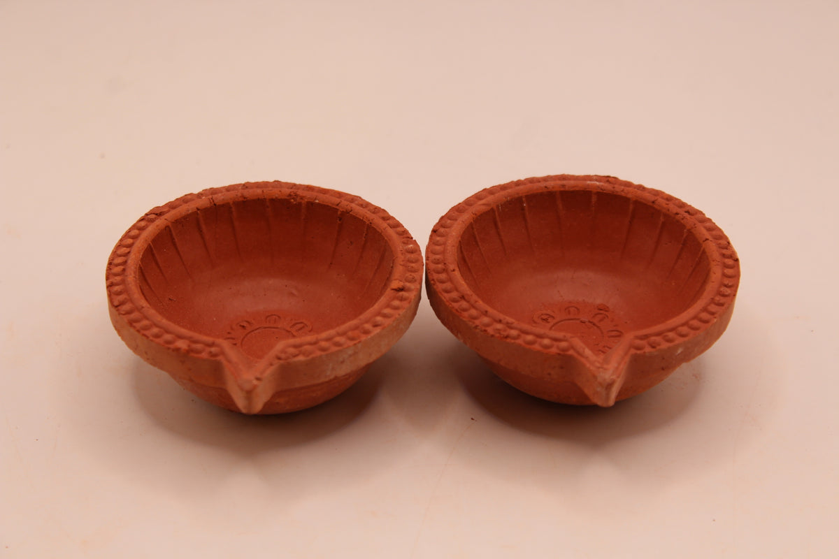 One Face Lined clay diya, front